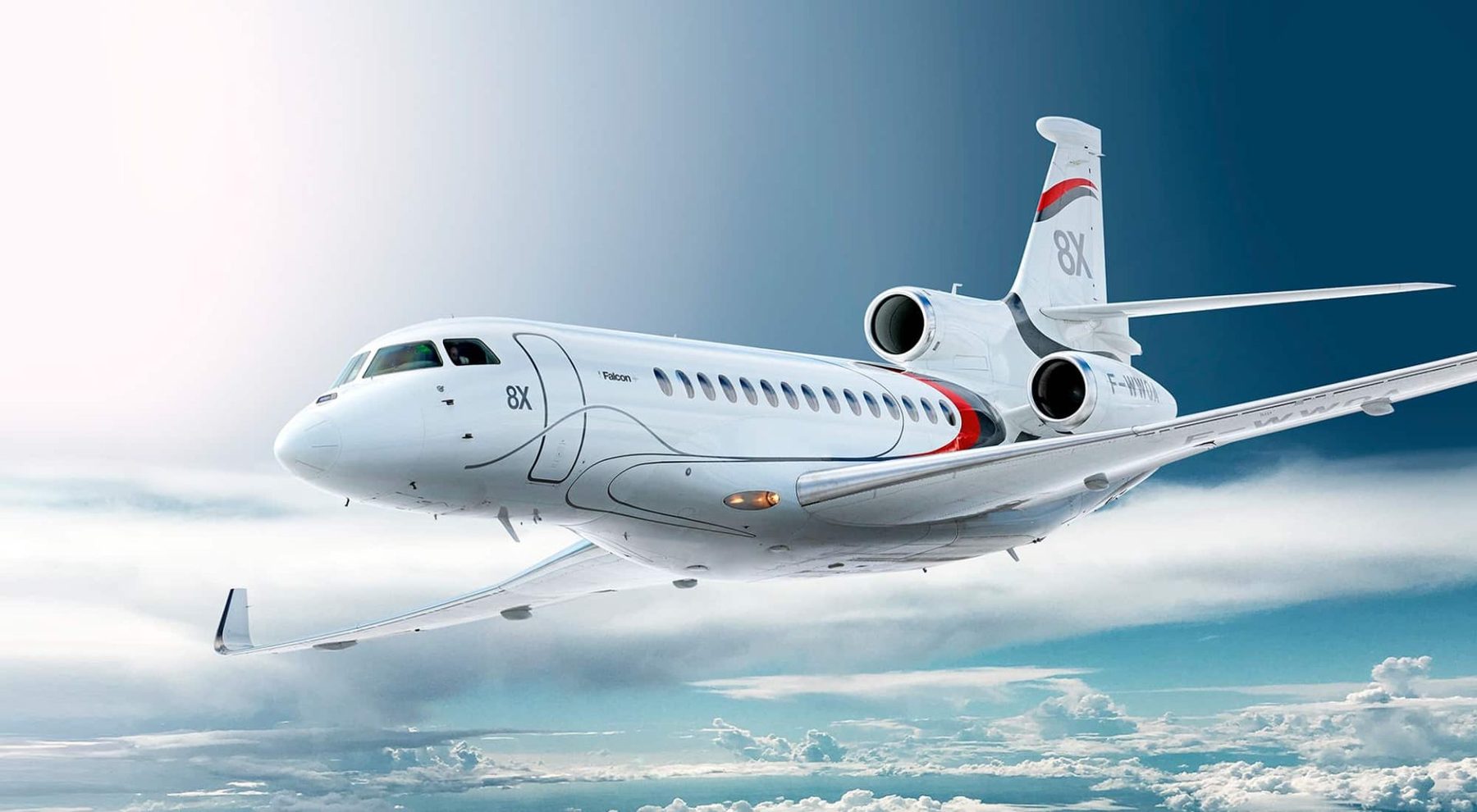Dassault Falcon 8X business jet in flight above the clouds